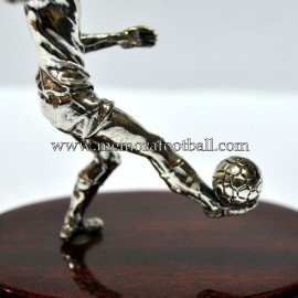 A silver figure of a footballer. Spain 1990s 